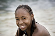 © Erickson Stock - Portrait of a smiling teenage girl sitting outdoors