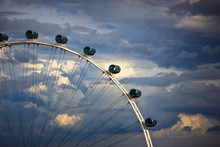 Ferris Wheel Against Cloudy Sky