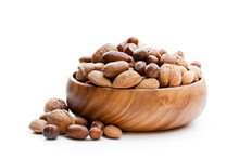 Various  Nuts In Wooden Bowl Isolated On White