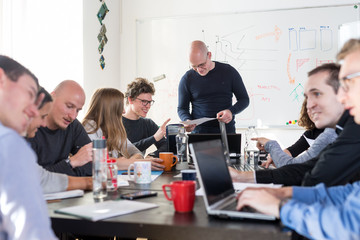 Wall Mural - relaxed informal it business startup company meeting. team leaders discussing and brainstorming new 