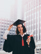© ronnarong - Graduation day, Young woman with graduation cap and gown holding diploma, Successful concept