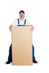 Delivery man standing behind large cardboard box