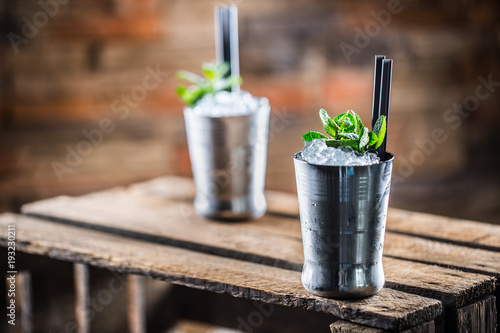 Valokuva Mint julep cocktail alcoholic drink on wooden board in pub or restaurant