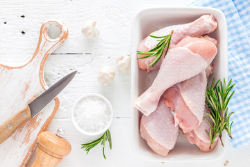 Poster - Raw chicken legs, fresh poultry drumsticks on white wooden table, top view