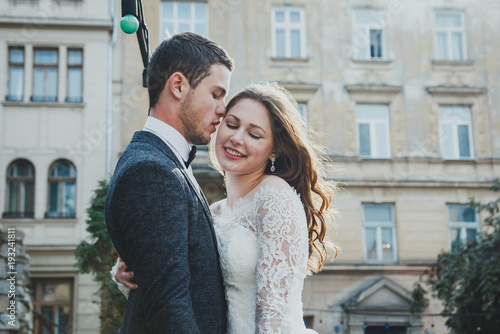 Wedding Couple Kisses And Hugs In The Old City Rustic Bride With