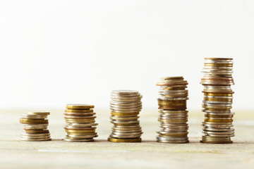 coins stack on wooden table