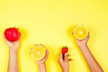 Wall Mural - Healthy food concept. Many kids hands with fuits. Top view