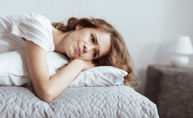 Wall Mural - Nervous breakdown. Worried mature brunette grimacing while thinking about something serious and trying to solve her problem.