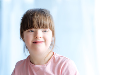 Portrait of cute kid with down syndrome