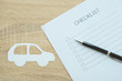 Closed up of checklist with car inspection - to do list
