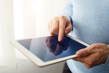 Wall Mural - man using banking on tablet in office