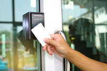 Close-up Hand Inserting Keycard To Lock And Unlock Door 
