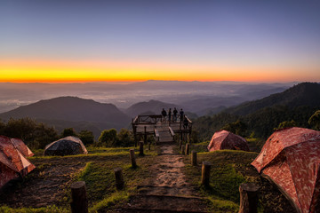 Wall Mural - beautiful sunrise mountain landscapes with tent at view point doi angkang , chiang mai , thailand