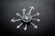 Direction of movement, travel direction. Compass among the arrows on black background top view copy space