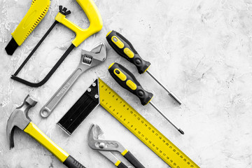 Wall Mural - Various repair tools. Must-have for men. Equipment for building. Repair tool kit. Grey background top view pattern copy space