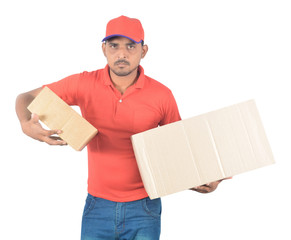 Young delivery man carrying carton boxes in uniform