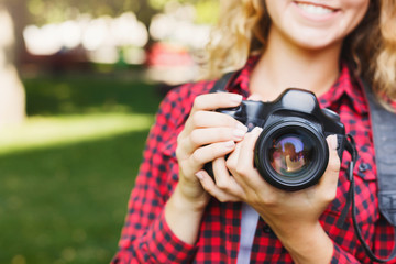 Wall Mural - Woman taking photos while standing in the park