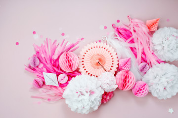 Wall Mural - Pink and white Paper Decorations for Baby  party. Flat lay, top view