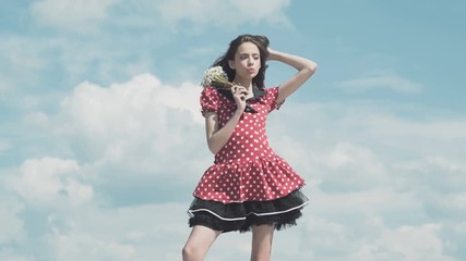 Wall Mural - Nice girl. Blue sky. Dreaming. Girl posing. lovely girl enjoys beautifule spring day.