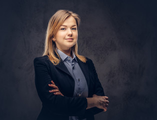 Studio portrait of a blonde businesswoman in a formal suit. Isol