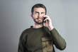 © Teodor Lazarev - Bored and frustrated man having a dull conversation over his cell phone