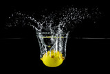 Fototapeta  - lemon in water splash