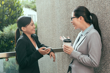 women chatting together talking