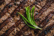 close-up view of delicious grilled spicy beefsteak with rosemary