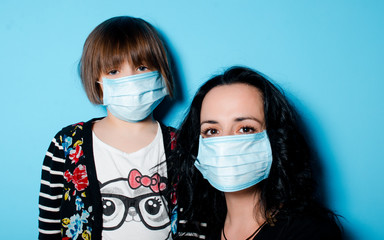 Mother and daughter in a sterile mask. The concept of a viral disease. Bad feeling. Sterile face mask