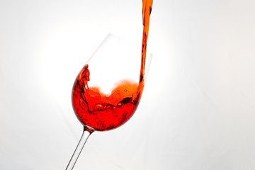 Red wine or juice poured into a glass