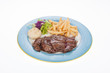 © gonzalocalle - Roasted veal fillet with French fries and salad