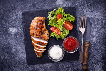 Grilled chicken breast with vegetable salad