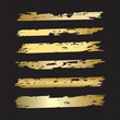 Set of brush strokes - isolated gilded on black background - art vector