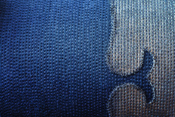 Texture of sewnn jeans fabric with decorative element