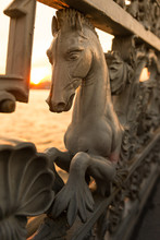 Iron Railings Of The Fence With Horses On Annunciation Bridge Decorated With Hippocampus Or Hippocamp, Often Called A Sea-horse, Close Up, Vertical/
