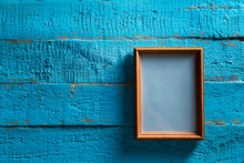 Wooden Photo Frame On Old Blue Wooden Textured Wall With Empty Place For Text Or Image