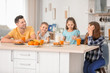 © Africa Studio - Happy family having breakfast in kitchen