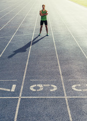 Wall Mural - sprinter standing on running track