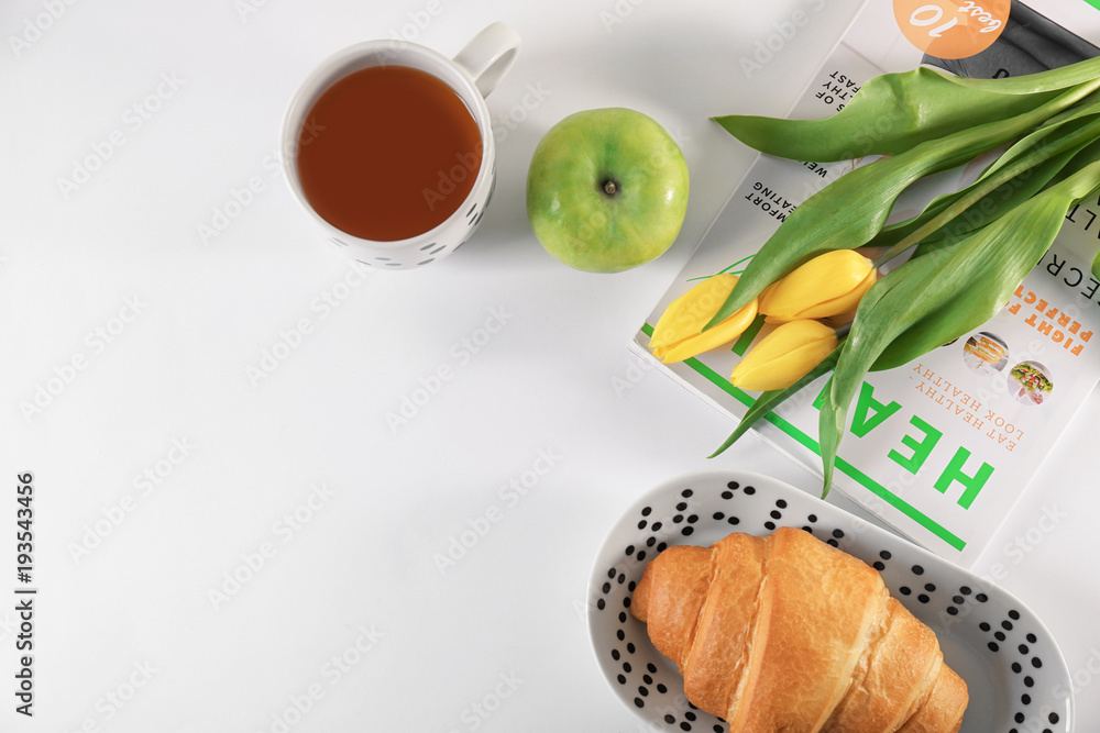 Composition with tasty breakfast and flowers on table, top view