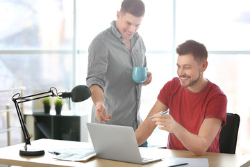 Sticker - Young men with laptop indoors