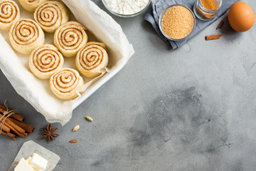 Wall Mural - Cinnamon rolls with ingredients