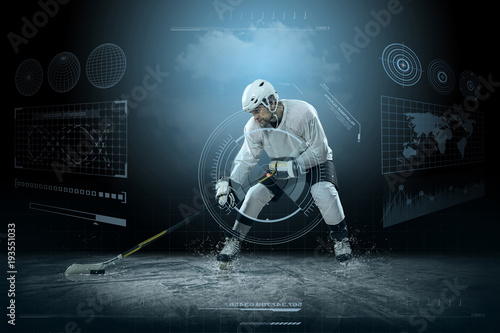 Fototapeta na szkło Ice hockey player on the ice around modern light