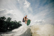© fesenko - wakeboarder performs various tricks in a jump