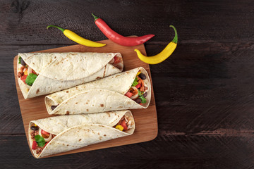 Wall Mural - Mexican burritos with chili peppers, and copyspace