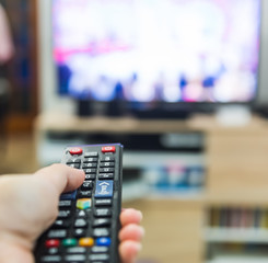 Woman holding a remote control