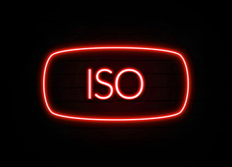 Iso neon sign on brick wall background.