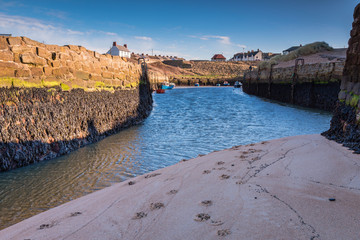 Wall Mural - Low tide at Seaton Sluice Harbour entrance / Seaton Sluice is a village on the Northumberland coast, with a natural harbour formed by the Seaton Burn