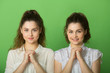 © Alexandr - two beautiful positive girls with joyful emotions on a green background
