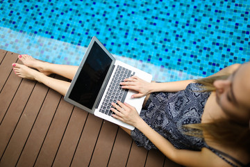 Wall Mural - portrait of happy woman and laptop. girl looking at camera happy, concept of new technologies, compu
