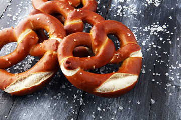 Wall Mural - German pretzels with salt close-up on the table.